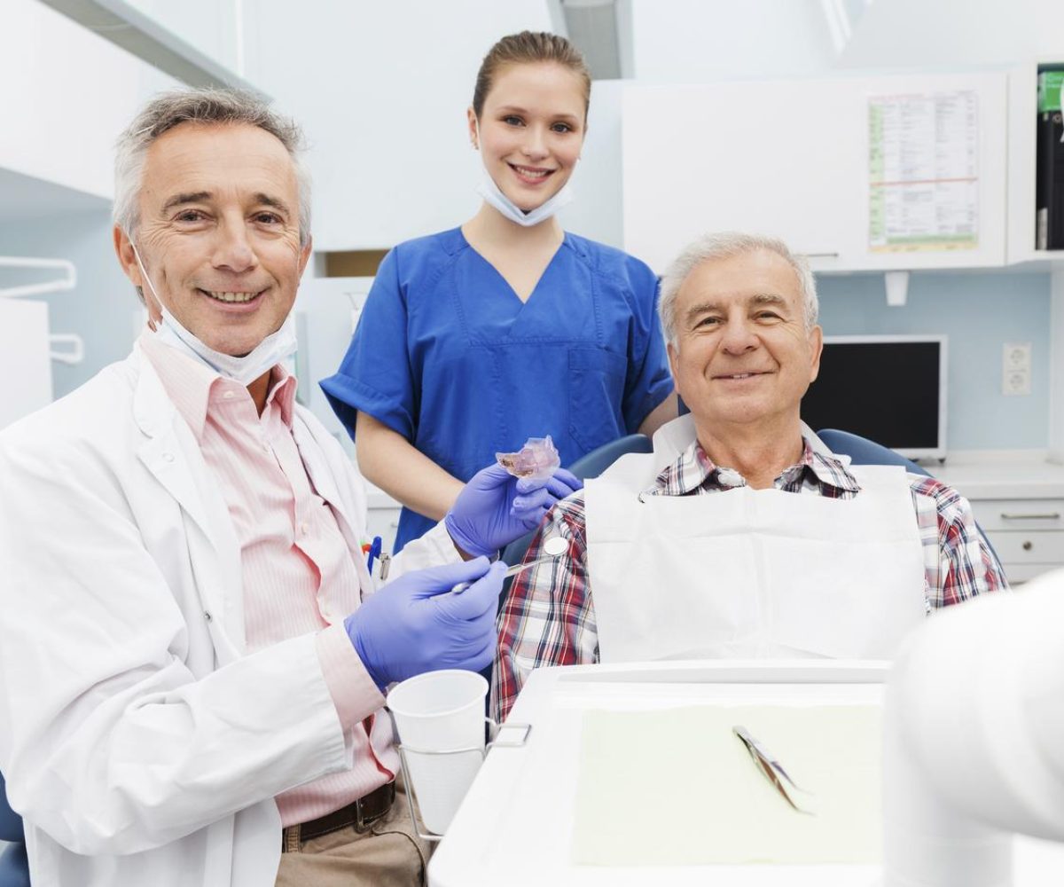 Dentist-Fitting-Patient-With-SomnoDent-Fusion.jpg